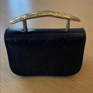 Elegant Black Handbag with Gold Handle